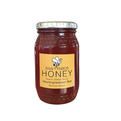 Jar of Raw Fynbos Honey with a yellow label on a white background